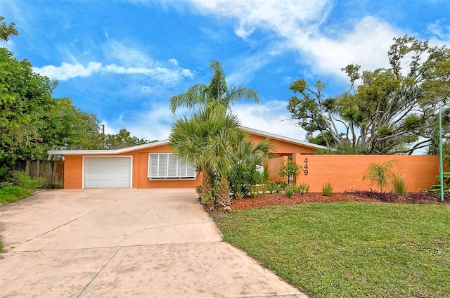 view of front facade with a front lawn and a garage