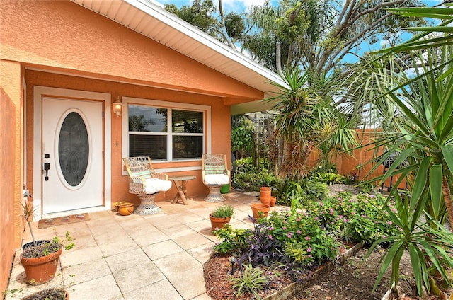 doorway to property featuring a patio