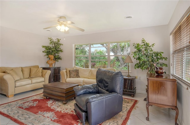 tiled living room featuring ceiling fan