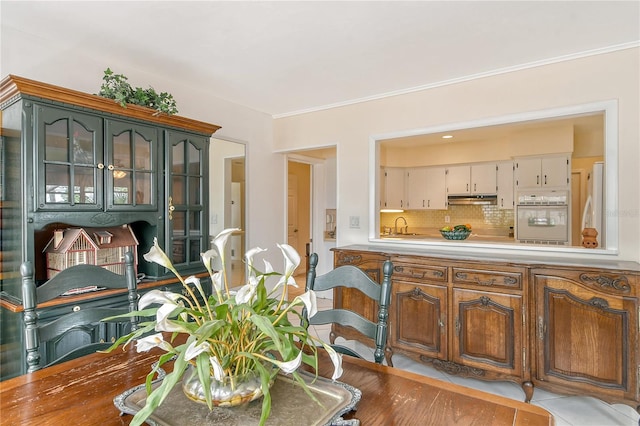 tiled dining room with sink