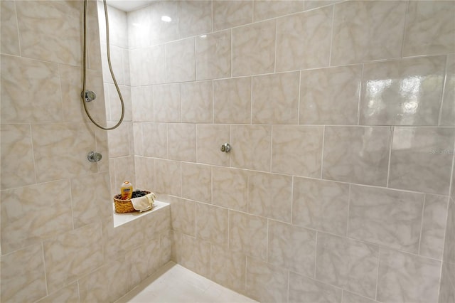 bathroom with tiled shower