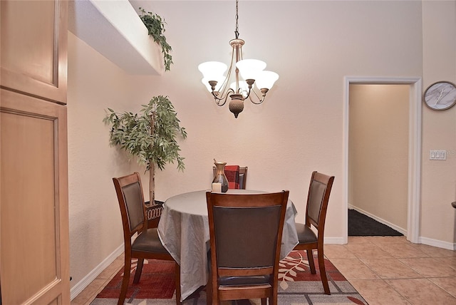 dining area with light tile floors and a notable chandelier