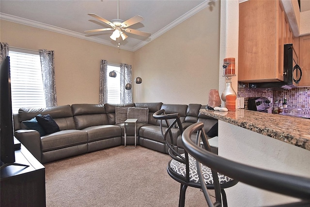 living room featuring carpet floors, ceiling fan, and ornamental molding