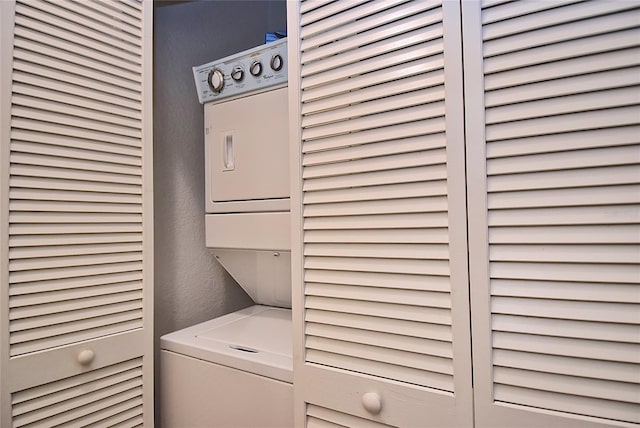 laundry area featuring stacked washer and clothes dryer