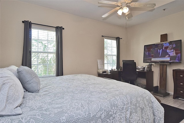 bedroom featuring wood-type flooring and ceiling fan