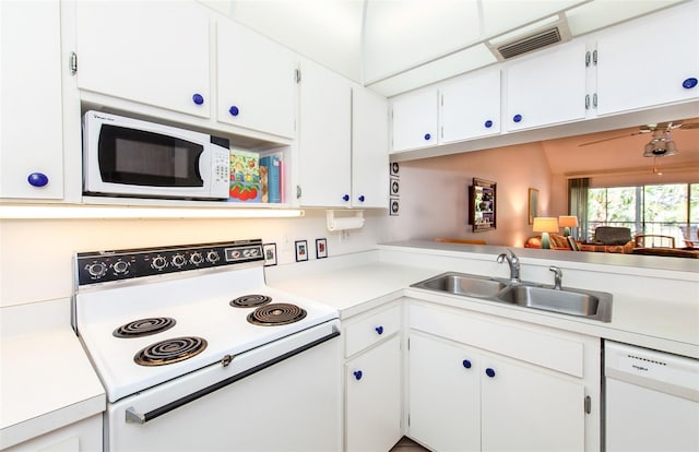 kitchen featuring white appliances, ceiling fan, white cabinets, and sink