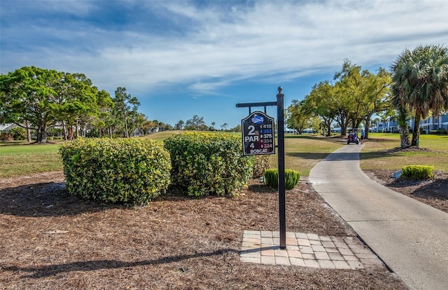 view of property's community with a yard