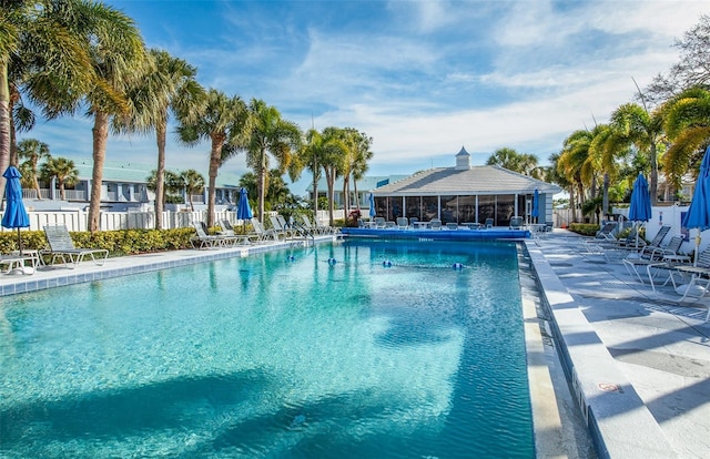 view of swimming pool featuring a patio