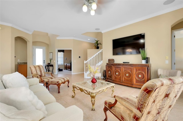 living room featuring light tile patterned flooring and ornamental molding