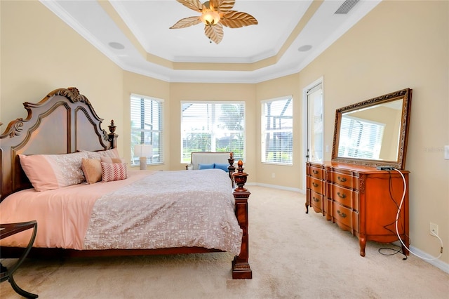 bedroom with a raised ceiling, ornamental molding, light carpet, and ceiling fan