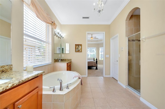 bathroom with tile patterned flooring, ornamental molding, vanity, and plus walk in shower