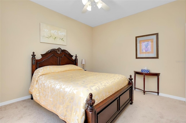 bedroom featuring light carpet and ceiling fan