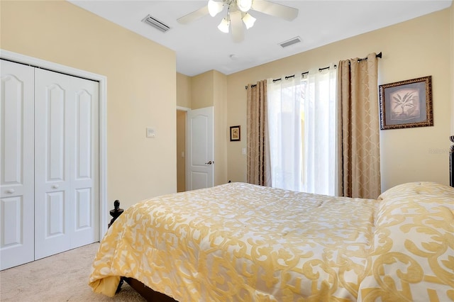 bedroom featuring light carpet, a closet, and ceiling fan