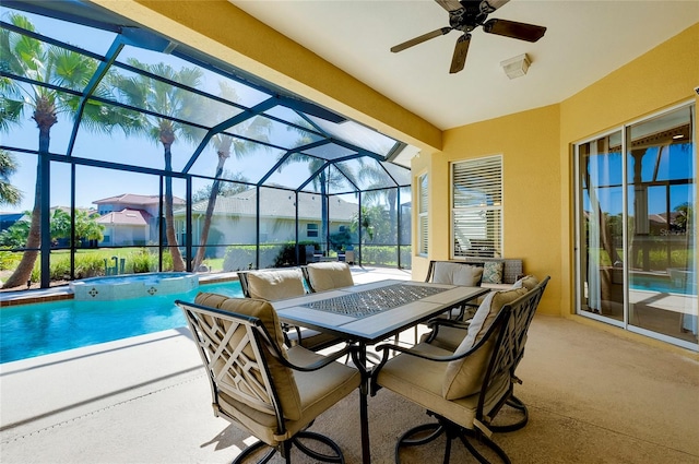 exterior space featuring ceiling fan and glass enclosure