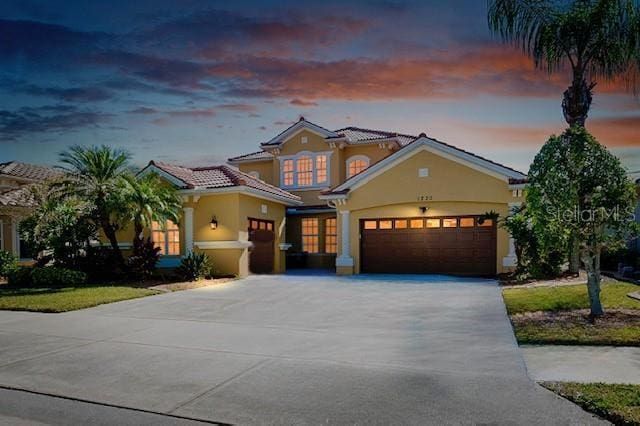 mediterranean / spanish-style house featuring a garage