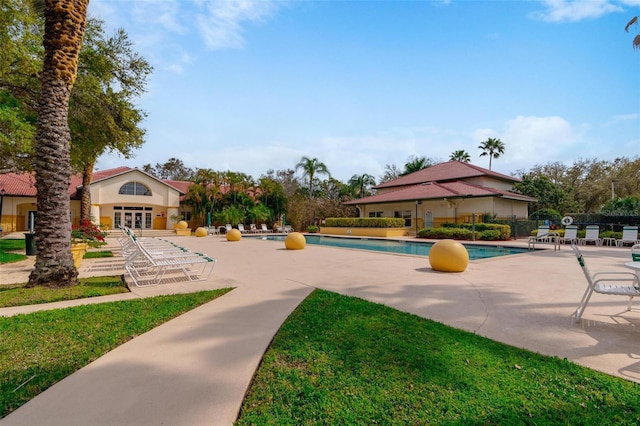 view of nearby features featuring a swimming pool and a patio area