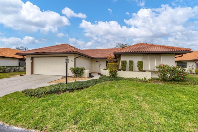 view of front of house featuring a garage, a tile roof, driveway, stucco siding, and a front lawn