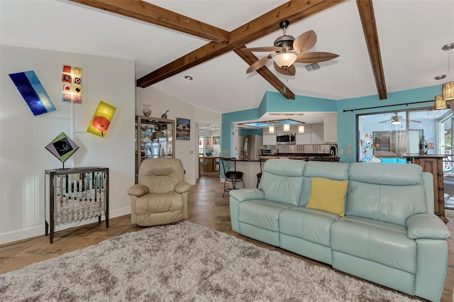 living room with ceiling fan and vaulted ceiling with beams