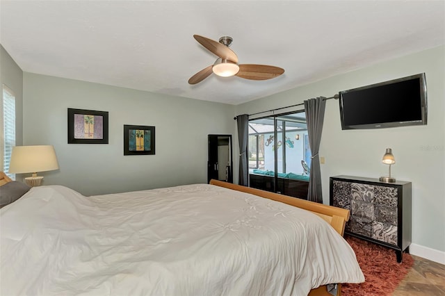 bedroom featuring baseboards, ceiling fan, and access to outside