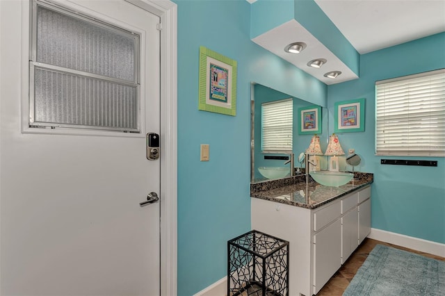 bathroom featuring vanity and baseboards