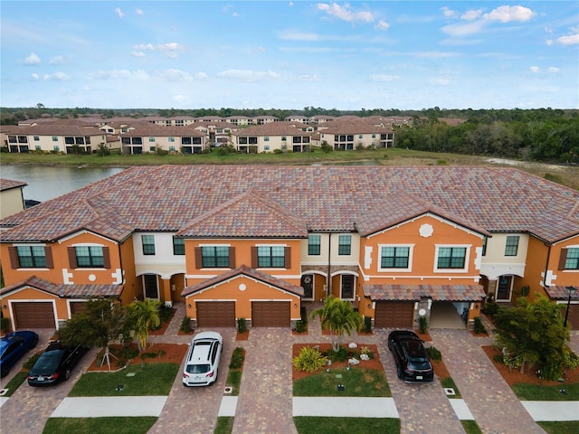 multi unit property featuring a garage