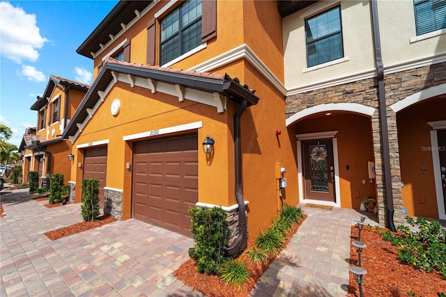 entrance to property featuring a garage