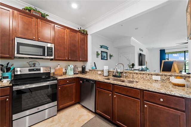 kitchen featuring appliances with stainless steel finishes, kitchen peninsula, sink, and light tile flooring