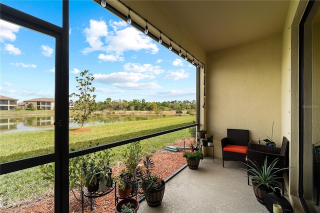 sunroom with a water view