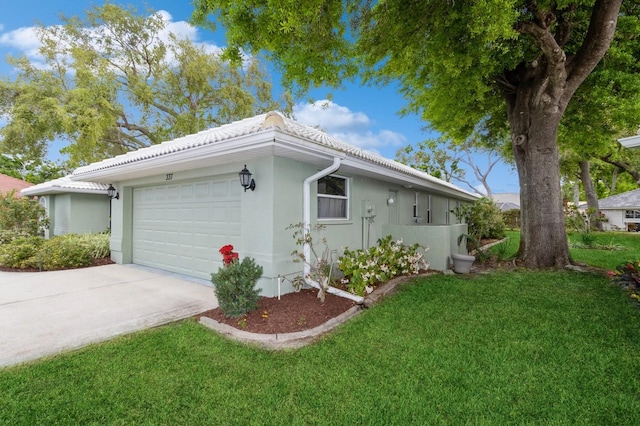 view of home's exterior featuring a yard and a garage