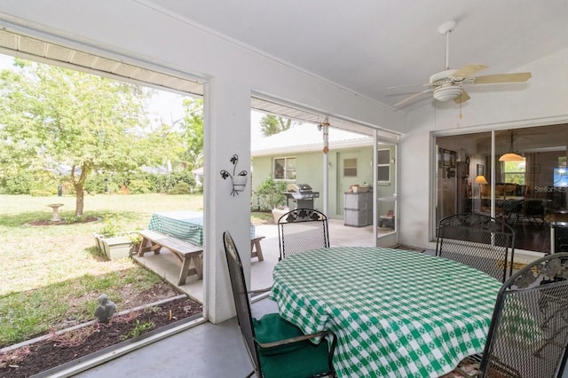 sunroom / solarium with ceiling fan