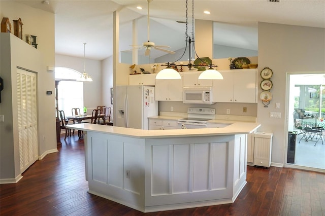 kitchen with white appliances, a healthy amount of sunlight, white cabinets, and dark hardwood / wood-style flooring