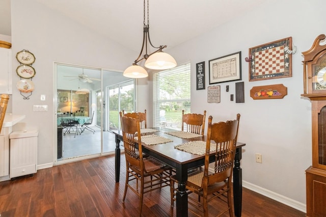 dining space with ceiling fan, dark wood-type flooring, and lofted ceiling