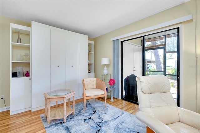 sitting room with light hardwood / wood-style floors