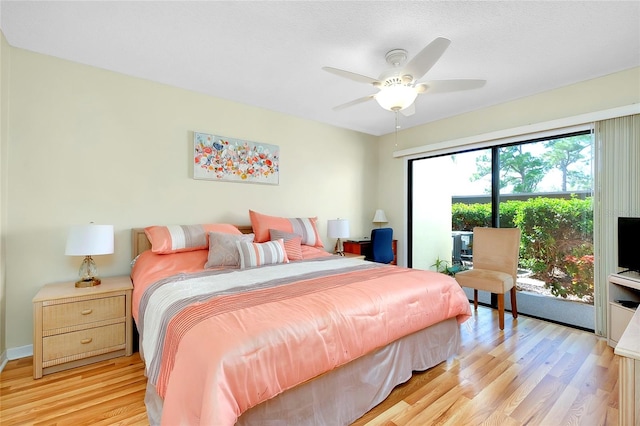 bedroom featuring access to outside, ceiling fan, and light wood-type flooring