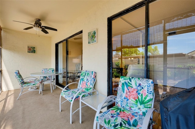 view of terrace featuring ceiling fan