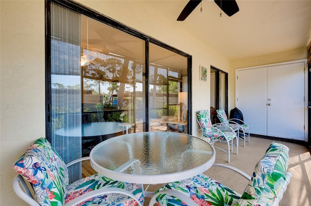 sunroom featuring ceiling fan