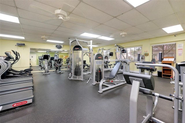 workout area featuring a drop ceiling and ceiling fan