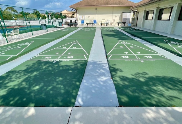 surrounding community with tennis court