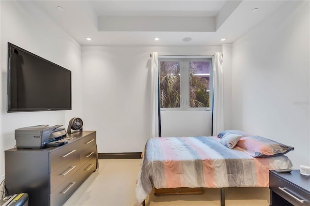 bedroom featuring a raised ceiling