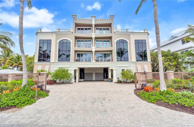 view of front of home featuring a balcony