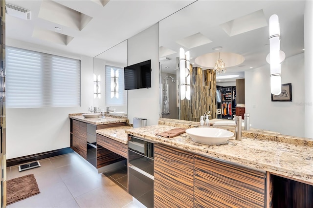 bathroom featuring tile patterned floors and vanity