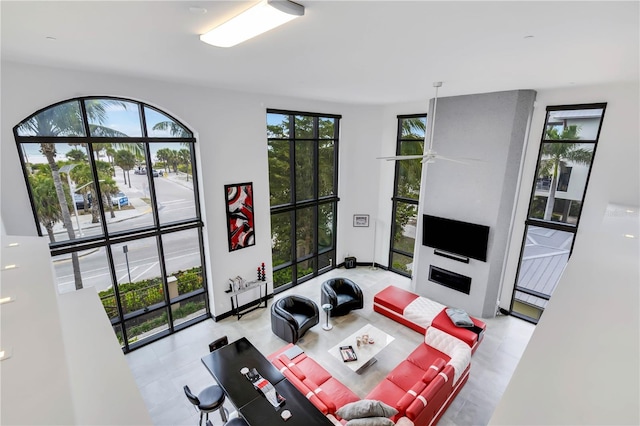 living room featuring a large fireplace