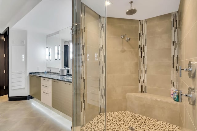 bathroom featuring an enclosed shower and vanity