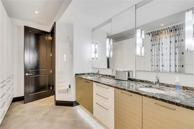 bathroom featuring vanity and tile patterned flooring