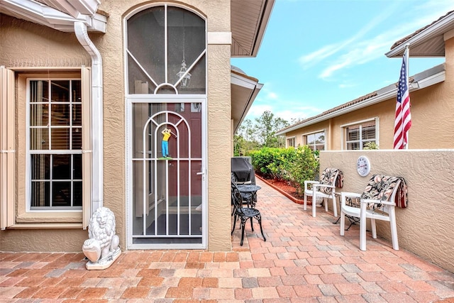 entrance to property featuring a patio