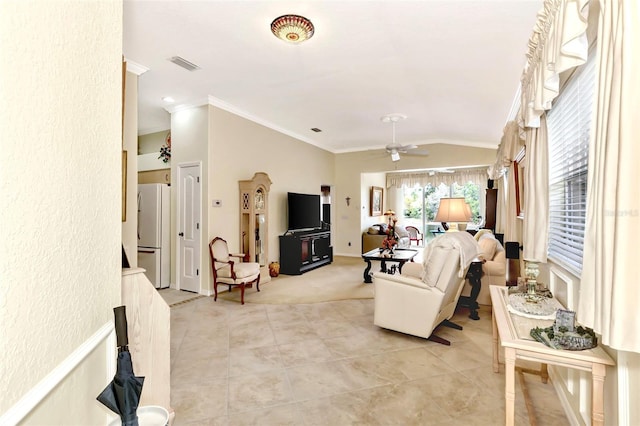 living room featuring light tile floors, ceiling fan, and crown molding