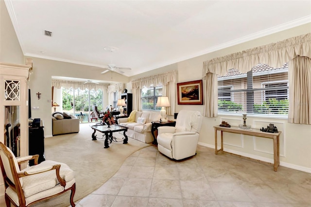 tiled living room featuring ornamental molding and ceiling fan