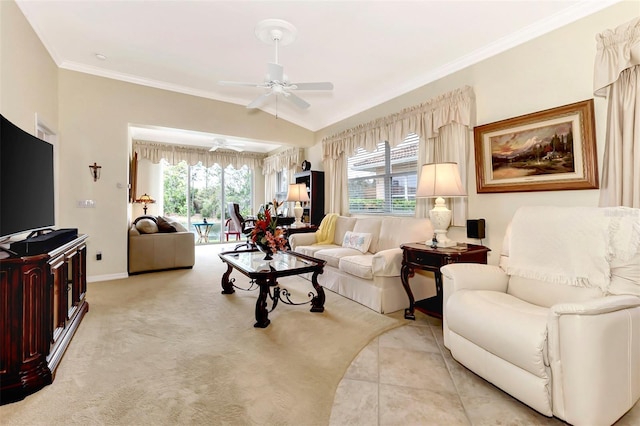 living room with crown molding, ceiling fan, and a wealth of natural light