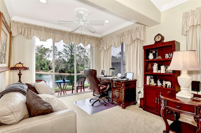 carpeted home office featuring crown molding, a water view, and ceiling fan