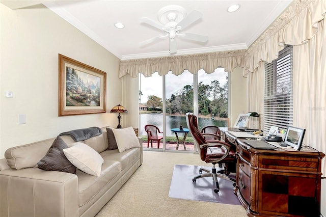 home office with a water view, crown molding, ceiling fan, and light colored carpet